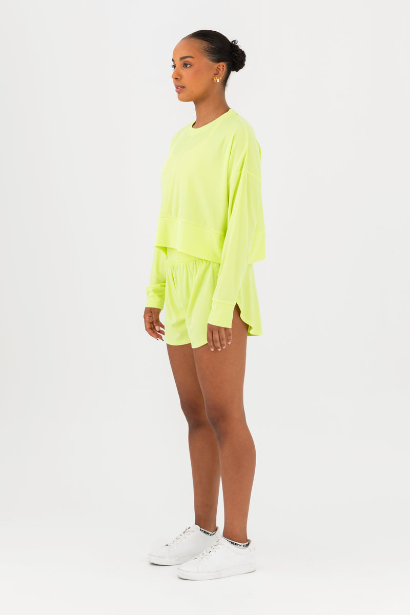 Every Turn Disco Pullover Sweater  In Yellow Zing, Oversized, Cropped Fit, Side View.