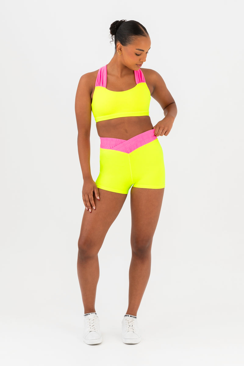 Every Turn Hawaii Short  In Yellow Zing, Crossover V-Waistband, Front View.